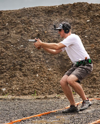 Competitor shooting a pistol stage at a MAPSA USPSA match